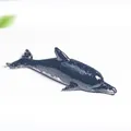 Minimalist black resin dolphin figurine with sparkling details and a high-gloss finish - Obsidian