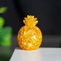 Golden resin pineapple ornament filled with natural yellow crystal for office desk decor - Citrine