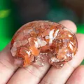 Labrador resin figurine with red crystal stones held in hand for desktop decoration - Red Agate