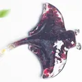 Resin manta ray sculpture with deep red garnet crystal stones and transparent finish - Garnet