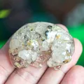 Sleeping labrador puppy figurine made of resin with golden rutilated quartz crystals - Rutilated Quartz