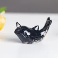 Mini resin narwhal sculpture with black crystal filling and translucent glossy finish - Obsidian