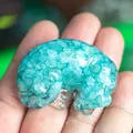 Sleeping cat resin ornament with cyan crystal stone filling in a handheld display - Aquamarine