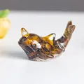 Miniature resin whale figurine featuring natural tiger eye stone textures and amber hues - Tiger's Eye