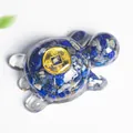 Resin turtle sculpture with blue crystal stones and golden lucky coin detail - Lapis Lazuli