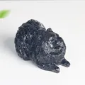 Pomeranian dog ornament in black resin with detailed fur texture and glossy finish - Obsidian