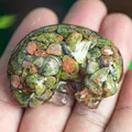 Sleeping Labrador resin dog figurine filled with green and brown natural crystals - Unakite