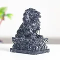 Polished black obsidian guardian lion sculpture with intricate resin base carving - Obsidian