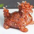 Amber-colored resin Dragon Turtle statue with intricate carvings for home decor - Red Agate