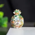 Golden pineapple resin ornament filled with green aventurine and natural crystal - Colorful Cat Eye