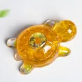 Resin turtle sculpture filled with yellow crystals and golden coin on back - Citrine