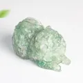 Pomeranian dog statue crafted from natural green fluorite resin with stone texture - Green Aventurine