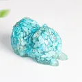 Pomeranian dog resin ornament featuring translucent blue crystal and textured fur detail - Turquoise