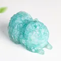 Blue resin crystal Pomeranian dog figurine with detailed fur texture and clear finish - Aquamarine