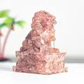 Pink strawberry crystal resin lion sculpture with traditional relief base for desk decor - Strawberry Quartz