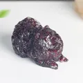 Resin Pomeranian ornament with deep red garnet crystal shards and textured fur details - Garnet
