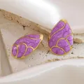 Golden drop earrings with purple marble texture on a luxury silk and stone background - Purple