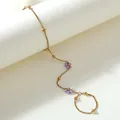 Detail of bohemian gold hand chain with delicate purple and white beaded daisies - Purple And White Style (BG040-purple-and-white)