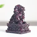 Resin crystal lion statue in deep red finish with traditional ornate base engraving - Garnet