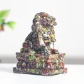 Traditional resin stone lion figurine with red green and yellow marbled texture on base - Dragon Blood Stone