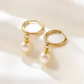 Close-up of elegant gold hoop earrings featuring polished white round pearls on silk - Artificial Pearl Drop Earrings (JX524) / Gold