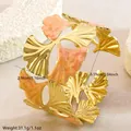 Bracciale rigido a foglia di ginkgo in oro con smalto rosa marmorizzato in acciaio inox - FYD6262SZ / Rosso Rosa