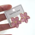 Detailed close-up of pink enamel floral earrings on a stainless steel jewelry card - Pink Flower Earrings (FYD6123EH)
