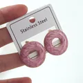 Detailed close-up of pink marble pattern donut earrings with gold-plated stainless steel edges - Pink Geometric Earrings (FYD6184EH)