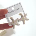 Starfish shaped stainless steel stud earrings with white marble texture and gold dots - Starfish Earrings (FYD6160EH)