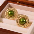 Vintage style round gold earrings with radial texture and a green pearl center inlay - Gold Base With Green Faux Pearl