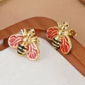 Boucles d'oreilles abeille en acier inoxydable 304 avec émail rouge et accents dorés - Rouge