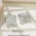 Detailed view of silver stainless steel square earrings with irregular hammered texture - Irregular Square (FYD6068-1)
