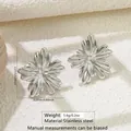 Detailed view of silver stainless steel flower earrings with 2.27cm size measurement - Stereo Flower (HQ6010-1)