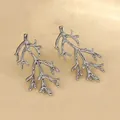 Detailed view of silver coral-shaped stud earrings with textured metallic finish - Coral Branch (FYD6094-1)
