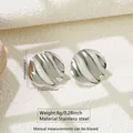 Detail of silver wavy round earrings showing 2.39cm size and stainless steel texture - Circular Ripple (FYD6158-1)