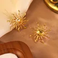 Golden sunflower earrings on beige silk fabric part of a luxury jewelry set - Sun Stud Earrings (FYD6065EH)