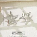 Macro detail of silver stainless steel star earrings with dimensions and weight info - Pentagram Style (FYD6146-1)
