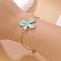 Elegant 18k gold plated stainless steel bracelet with turquoise enamel flower pendant - Bracelet / Blue Bracelet