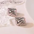 Detailed close-up of silver croissant dome earrings with polished mirror finish texture - Croissant Spiral (HQ6009-1)