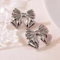 Minimalist silver steel bow earrings with a polished finish and elegant pleated texture - Pleated Bow (HQ6011-1)