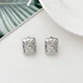 Macro detail of silver rectangular stud earrings with classic quilted texture design - Quilted Rectangle (HQ6015-1)