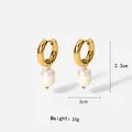 Detail view of 18K gold stainless steel hoop earrings with natural freshwater pearl drops - Gold