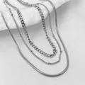 Layered stainless steel chain necklaces featuring snake, cuban, and bead styles - Steel