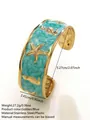 Bracciale rigido in acciaio dorato con smalto blu e motivi stella marina e cavalluccio - FYD6218SZ / Blu