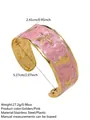 Bracciale aperto in marmo rosa con motivi dorati di cavallucci marini e stelle marine - FYD6218SZ / Rosa