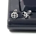 Macro shot of silver titanium clover earrings with black enamel and screw back detail - Clover Round Stud (Single) / 0.8mm Gauge - 6mm Bar Length / Silver
