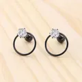 Detail of star zircon earrings with black hoop and secure screw-back ball closure - Black Round
