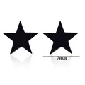 Macro detail of 7mm black star-shaped stud earrings made of stainless steel material - Star Style / Black