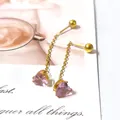 Detail of gold chain earrings featuring pink heart zircon pendants and delicate fringe - Pink Crystal Heart Tassel / One Pair / Gold