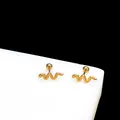 Close-up of gold snake earrings with textured scales and secure screw back balls - Snake Cartilage Stud / Gold